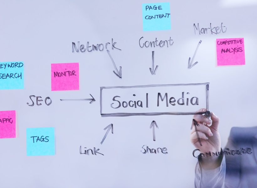 Cropped shot of a woman having a brainstorming session against a glass wall in a modern office.