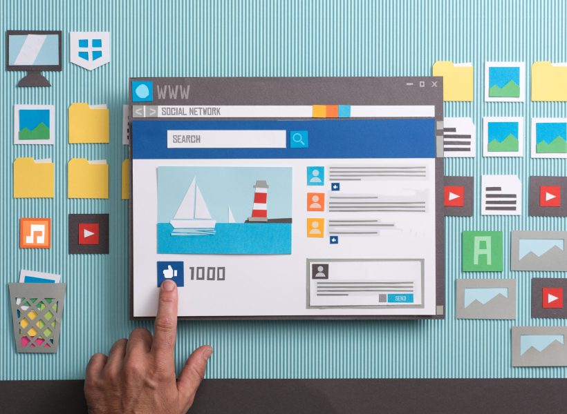 Social media post with comments in a browser window, a user is pressing the like button: social networks and community concept, collage and paper cut composition