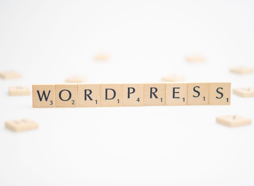 WORDPRESS word written on white background. WORDPRESS text on white for your designs, concept.